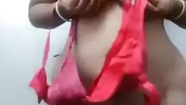 Desi wife performs a sex show flashing her XXX sized boobs on camera