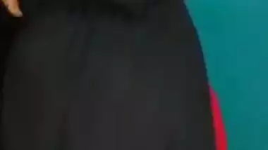 Desi female in a long black skirt exposes legs and boobies in sex show