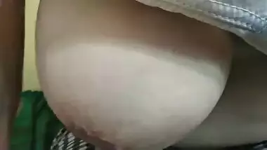 Homemade porn by Indian man uncovering and playing with wife's boobs