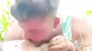 Young couple lovers enjoying sexy outdoor fun in the rice field