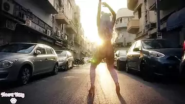 Colorful kawaii girl twerking in empty street during quarantine (no nudity)