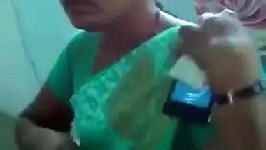 Horny Indian female un green helps man relax touching her XXX boobs