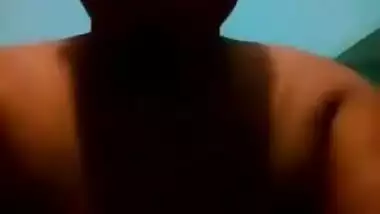 Mature Desi in a red sari exposes her big sex parts in a XXX show
