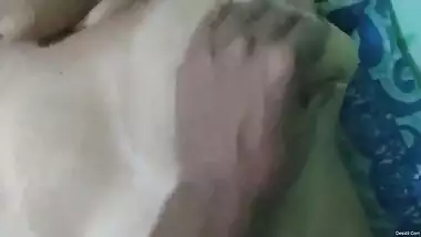 Guy lies on top of Indian teen and licks nipples to make twat wet